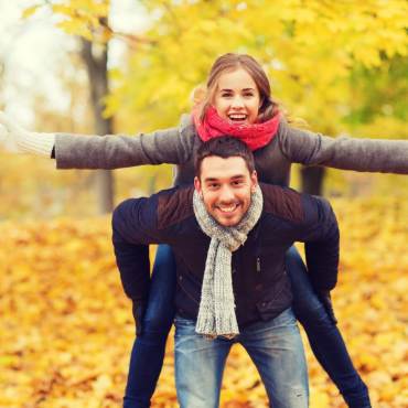 Parent and child enjoying autumn together