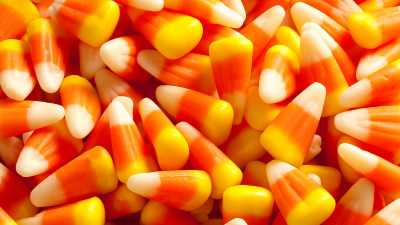 A close-up of orange, yellow, and white candy corn